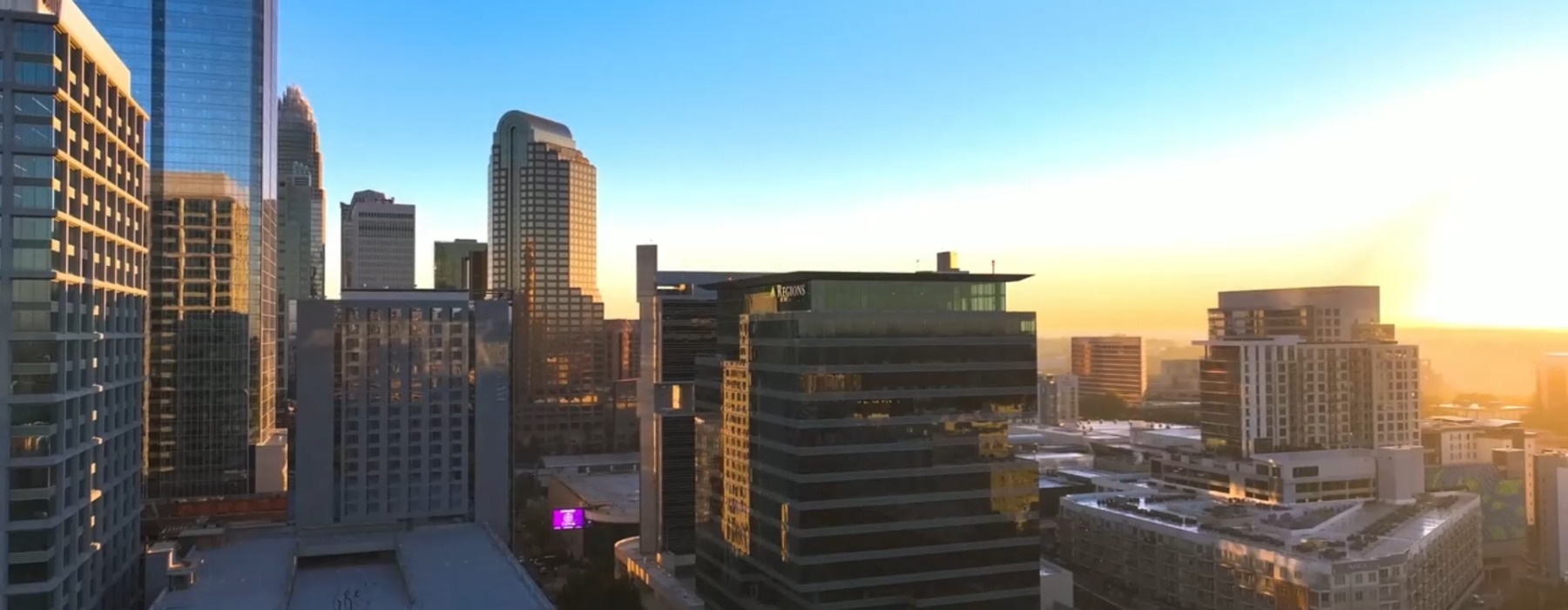 a city skyline an sunrise