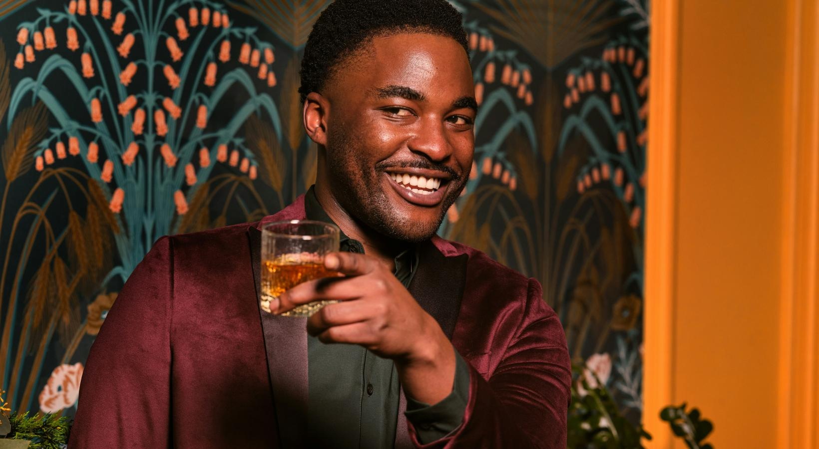 Find your perfect fit at Bond on Mint a man holding a glass of wine