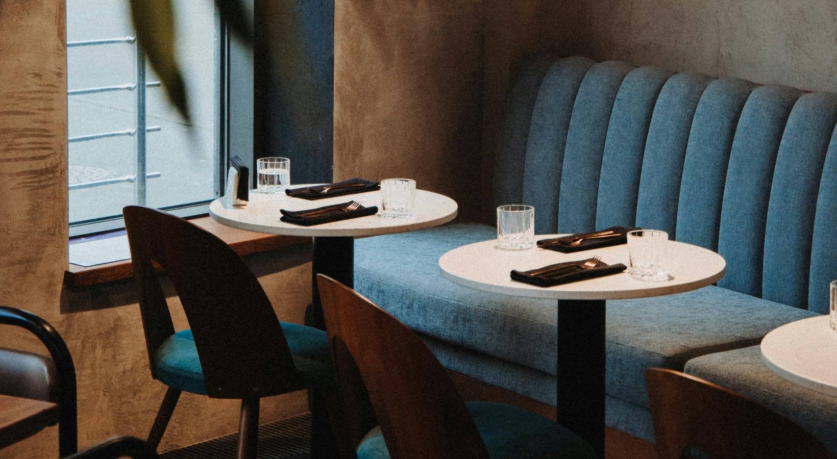 Close to the center of everything a room with tables and chairs